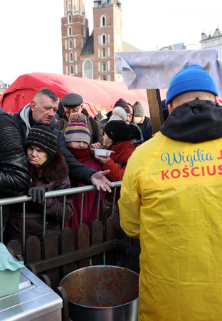 Krakow, Poland - Dec 17, 2023: Christmas Eve for the poor and homeless on the Main Square in Cracow. The group Kosciuszko prepares the greatest eve in the open air in Krakowのeditorial素材