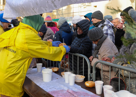 Krakow, Poland - Dec 17, 2023: Christmas Eve for the poor and homeless on the Main Square in Cracow. The group Kosciuszko prepares the greatest eve in the open air in Krakowのeditorial素材