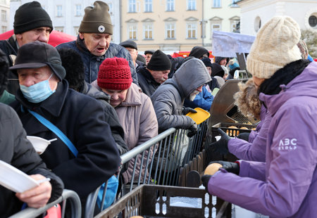 Krakow, Poland - Dec 17, 2023: Christmas Eve for the poor and homeless on the Main Square in Cracow. The group Kosciuszko prepares the greatest eve in the open air in Krakowのeditorial素材