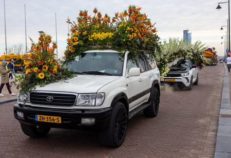 Noordwijk, Netherlands - April 22, 2023: Cars decorated with flowers taking part in the Bloemencorso Bollenstreek the annual spring flower parade from Noordwijk to Haarlem in the Netherlands.のeditorial素材