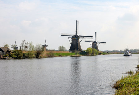 Kinderdijk, the Netherlands - April 17, 2023: 19 windmills at Kinderdijk built about 1740 is part of a larger water management system to prevent flooding. A UNESCO world heritage site.のeditorial素材