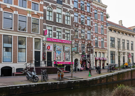 Amsterdam, Netherlands - April 21, 2023: Strip club with live sex shows in De Wallen called the red light district famous for its entertainment character: brothels, coffee shops, pubs and restaurantsのeditorial素材