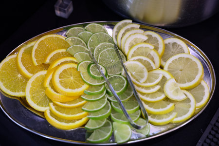 Mixed citrus fruit on plateの写真素材