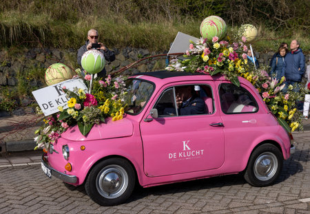 Noordwijk, Netherlands - April 22, 2023: Cars decorated with flowers taking part in the Bloemencorso Bollenstreek the annual spring flower parade from Noordwijk to Haarlem in the Netherlands.のeditorial素材