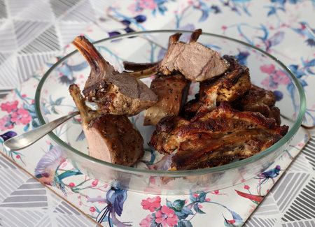 Baked, ready-to-eat saddle of lamb in a glass dishの写真素材