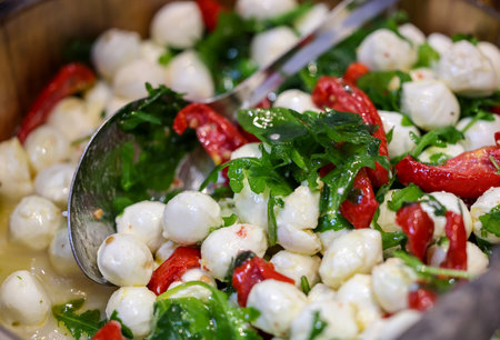 Salad with mozzarella, arugula and peppersの写真素材