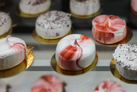 delicious milk meringues cake on golden plateの写真素材