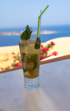 Mojito cocktail in a glass with a strawの写真素材