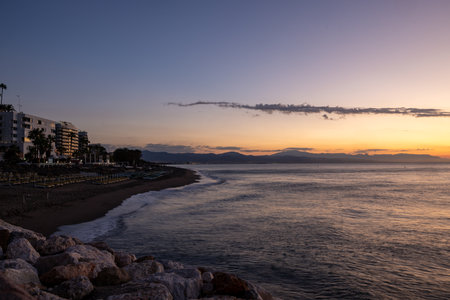 View of Bajondillo beach in Torremolinos just before sunrise. Costa del Sol, Spainの写真素材