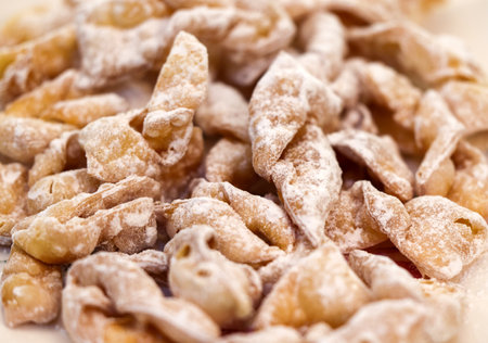Angel wings (Faworki), cakes. Sweet pastry deep fried and sprinkled with powdered sugarの写真素材