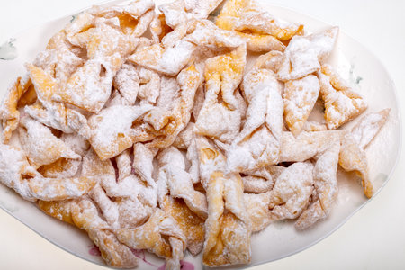 Angel wings (Faworki), cakes. Sweet pastry deep fried and sprinkled with powdered sugarの写真素材