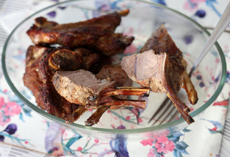 Baked, ready-to-eat saddle of lamb in a glass dishの写真素材