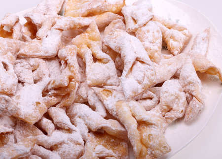 Angel wings (Faworki), cakes. Sweet pastry deep fried and sprinkled with powdered sugarの写真素材