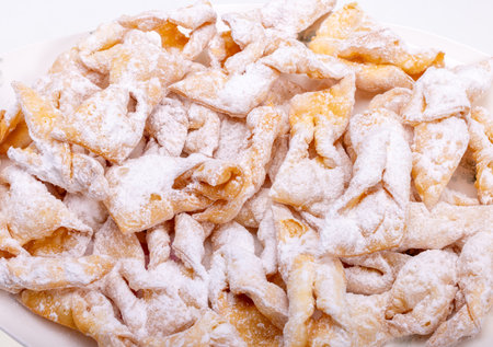Angel wings (Faworki), cakes. Sweet pastry deep fried and sprinkled with powdered sugarの写真素材
