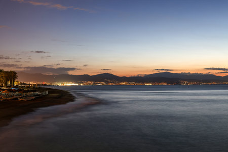 View from Torremolinos towards Malaga just before sunrise. Costa del Sol, Spain.の写真素材