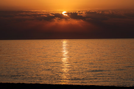 Sunrise over the Mediterranean Sea seen from the beach in Torremolinos. Costa del Sol, Spainの写真素材