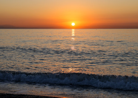 Sunrise over the Mediterranean Sea seen from the beach in Torremolinos. Costa del Sol, Spainの写真素材