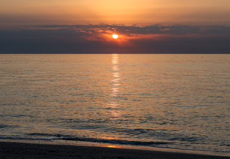 Sunrise over the Mediterranean Sea seen from the beach in Torremolinos. Costa del Sol, Spainの写真素材
