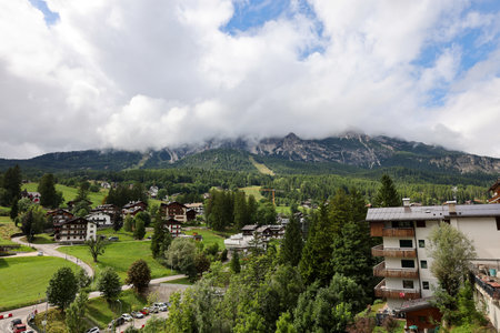 View from Cortina d Ampezzo of the Dolomites shrouded in clouds. Italyの写真素材