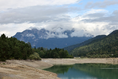 View from Cortina d Ampezzo of the Dolomites shrouded in clouds. Italyの写真素材