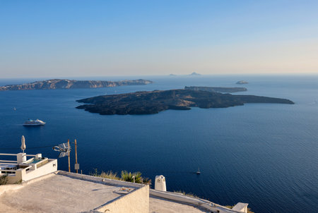View from Santorini to volcanic island Nea Kamena, Cyclades, Greece