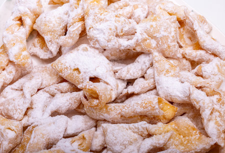 Angel wings (Faworki), cakes. Sweet pastry deep fried and sprinkled with powdered sugarの写真素材