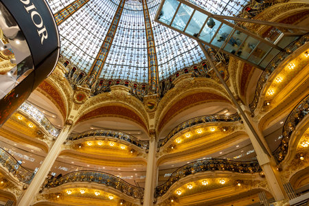 Paris, France - March 18, 2025: Galeries Lafayette interior in Paris. The architect Georges Chedanne designed the store with a Art Nouveau glass and steel domeのeditorial素材