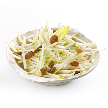 fresh apple salad with raisins and chicoryの写真素材