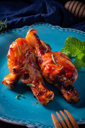 Orleans roasted chicken drumsticks in a dark atmosphereの写真素材