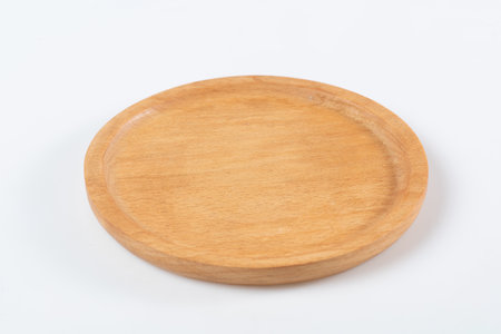 Wooden plate isolated on white background with clipping path for design.の写真素材