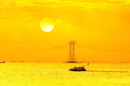 electric pillar over blue sky in sunset の写真素材