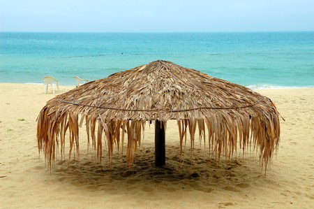 Beach umbrella under blue skyの写真素材