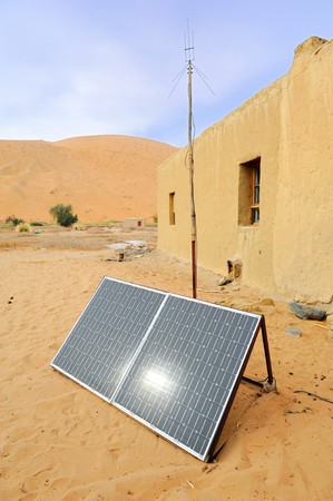 solar panel with desert house の写真素材