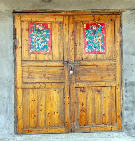 Wall of ancient wooden barn with doorのeditorial素材