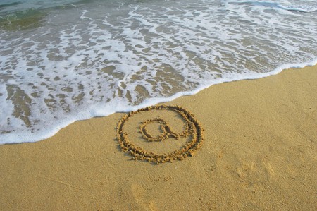 Email symbol draw on beach の写真素材