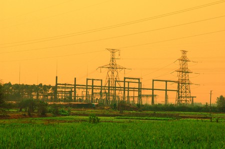 Electric pillar over blue sky in sunset 
