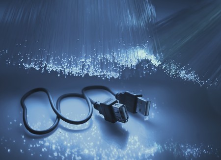 USB plugs closeup with fiber optical backgroundの写真素材