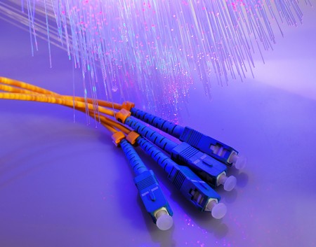 network cable closeup with fiber optical backgroundの写真素材