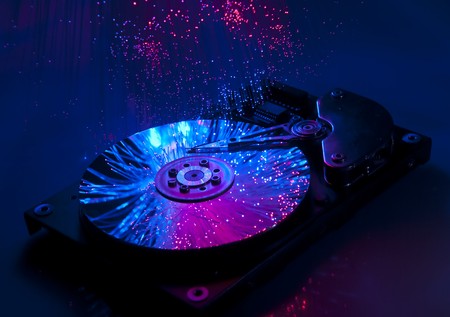 Computer hard drives with technology fiber optics background の写真素材