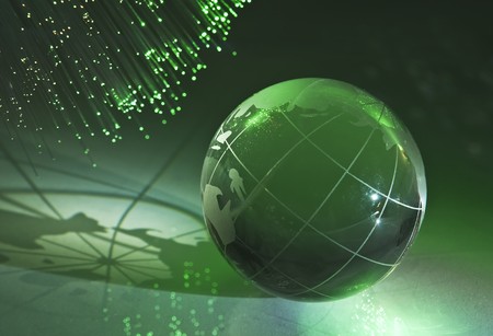 hi-tech earth globe against fiber optic background の写真素材