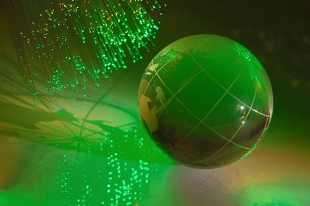 computer data concept with earth globe against fiber optic background more in my portfolioの写真素材