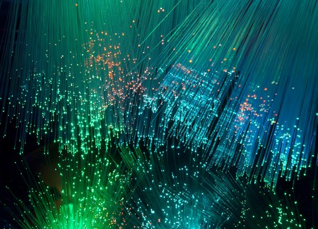 bunch of optical fibres dinamic flying from deep on technology backgroundの写真素材