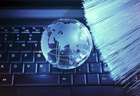 globe against fiber optic background の写真素材
