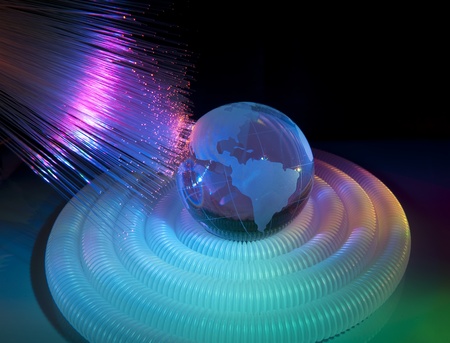technology earth globe against fiber optic backgroundの写真素材