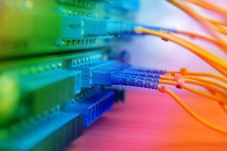 shot of network cables and servers in a technology data center