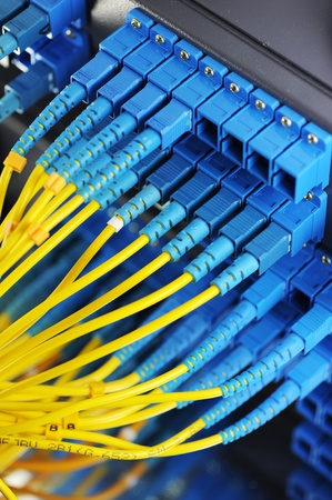 shot of network cables and servers in a technology data center