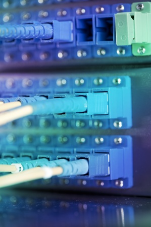shot of network cables and servers in a technology data center