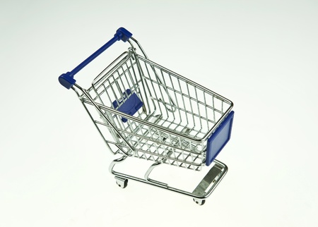 shopping cart over white background の写真素材