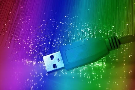USB plugs closeup with fiber optical background の写真素材