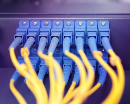 shot of network cables and servers in a technology data center